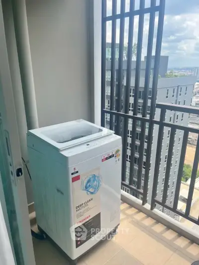 Modern apartment balcony with washing machine and city view