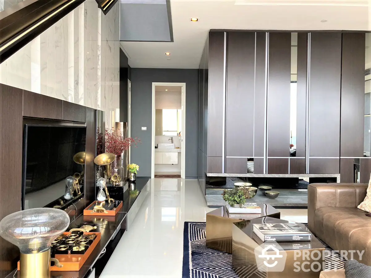 Luxurious living room with sleek modern design, featuring a large brown sofa, elegant fireplace, and sophisticated cabinetry, perfect for upscale urban living.