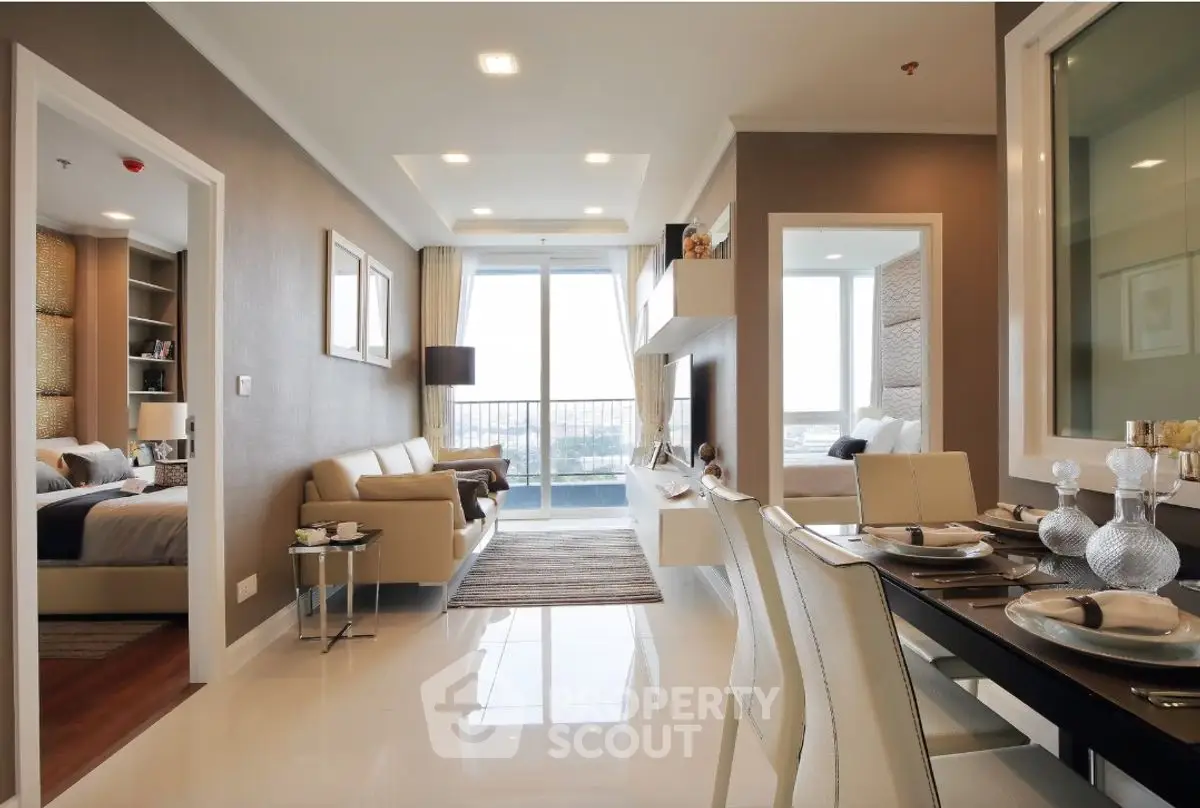 Modern open-plan living and dining area with elegant decor and natural light