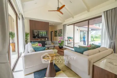 Spacious modern living room with large windows and elegant decor