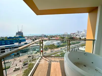 Stunning balcony with jacuzzi offering panoramic city and ocean views, perfect for relaxation and luxury living.
