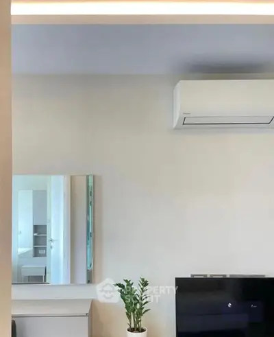 Modern living room with air conditioning and sleek decor