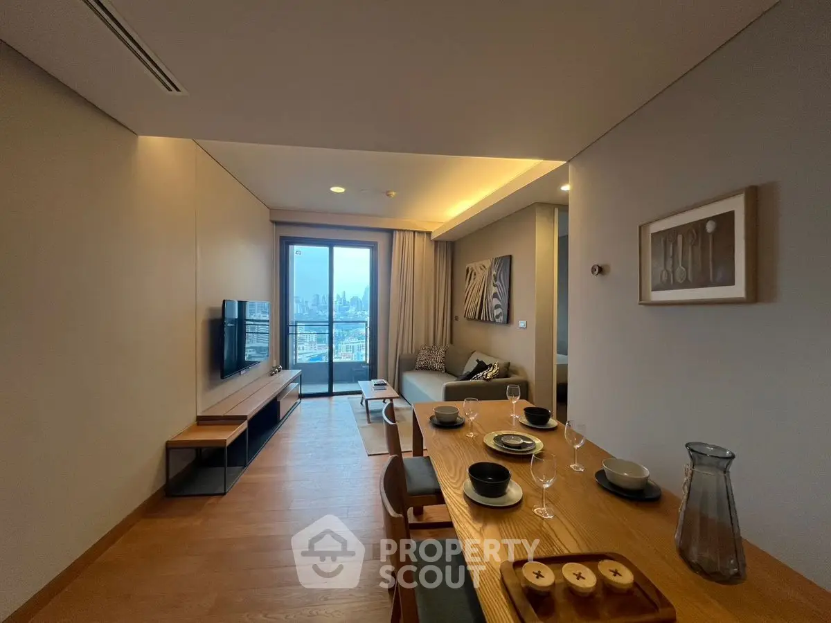 Modern living room with dining area and city view balcony