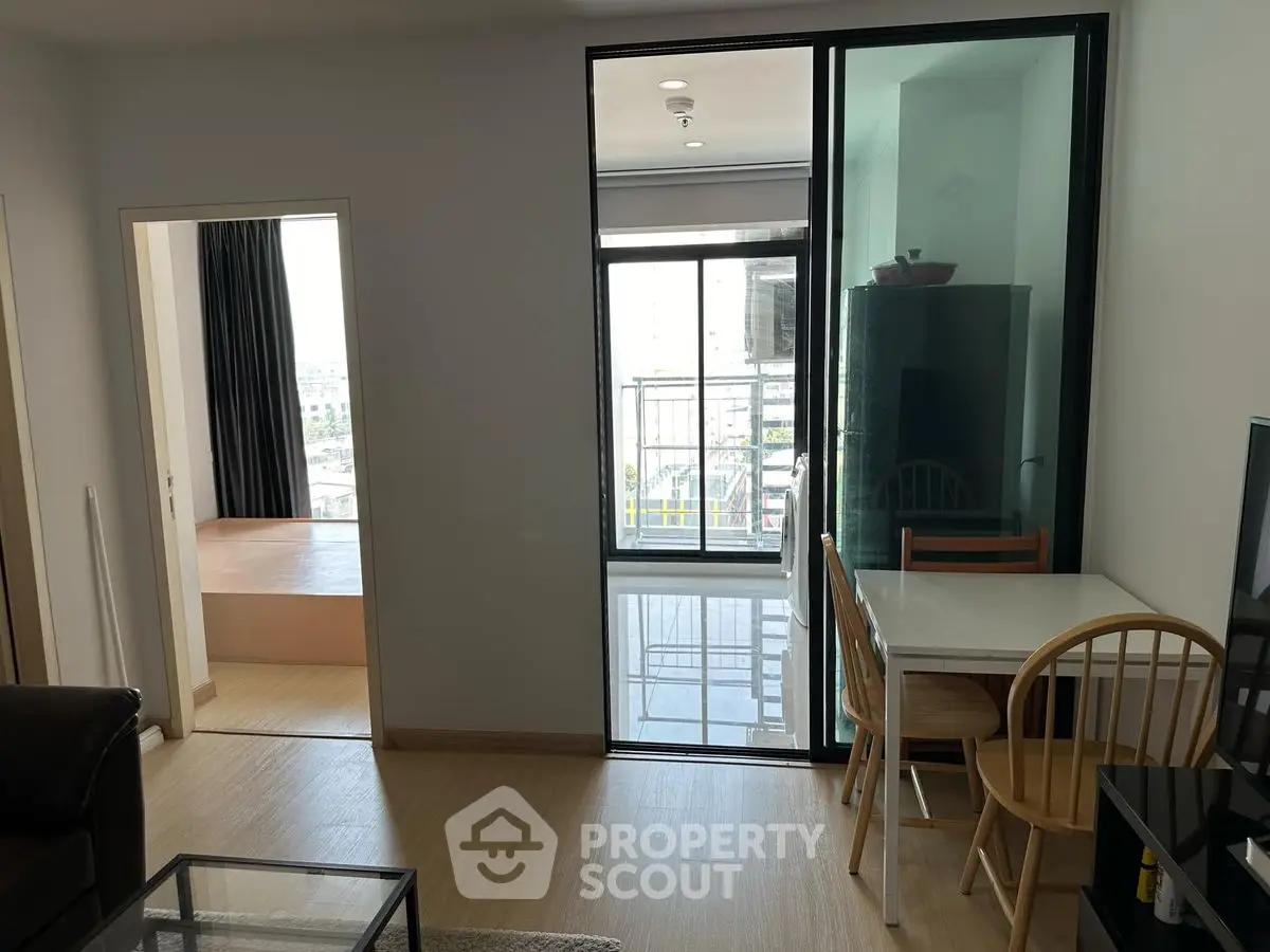 Modern apartment interior with open layout and balcony view