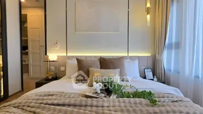 Luxurious bedroom with elegant decor and natural light, featuring plush bedding and stylish accents.