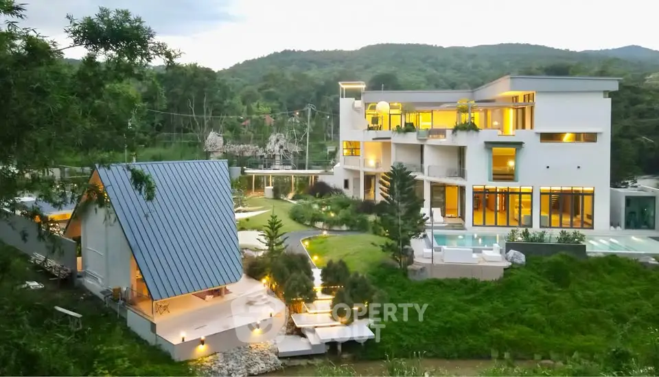 Luxurious modern villa with stunning architecture and lush greenery, featuring a pool and expansive outdoor space.