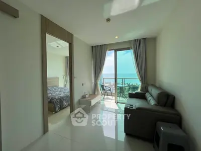 Modern living room with ocean view and balcony access