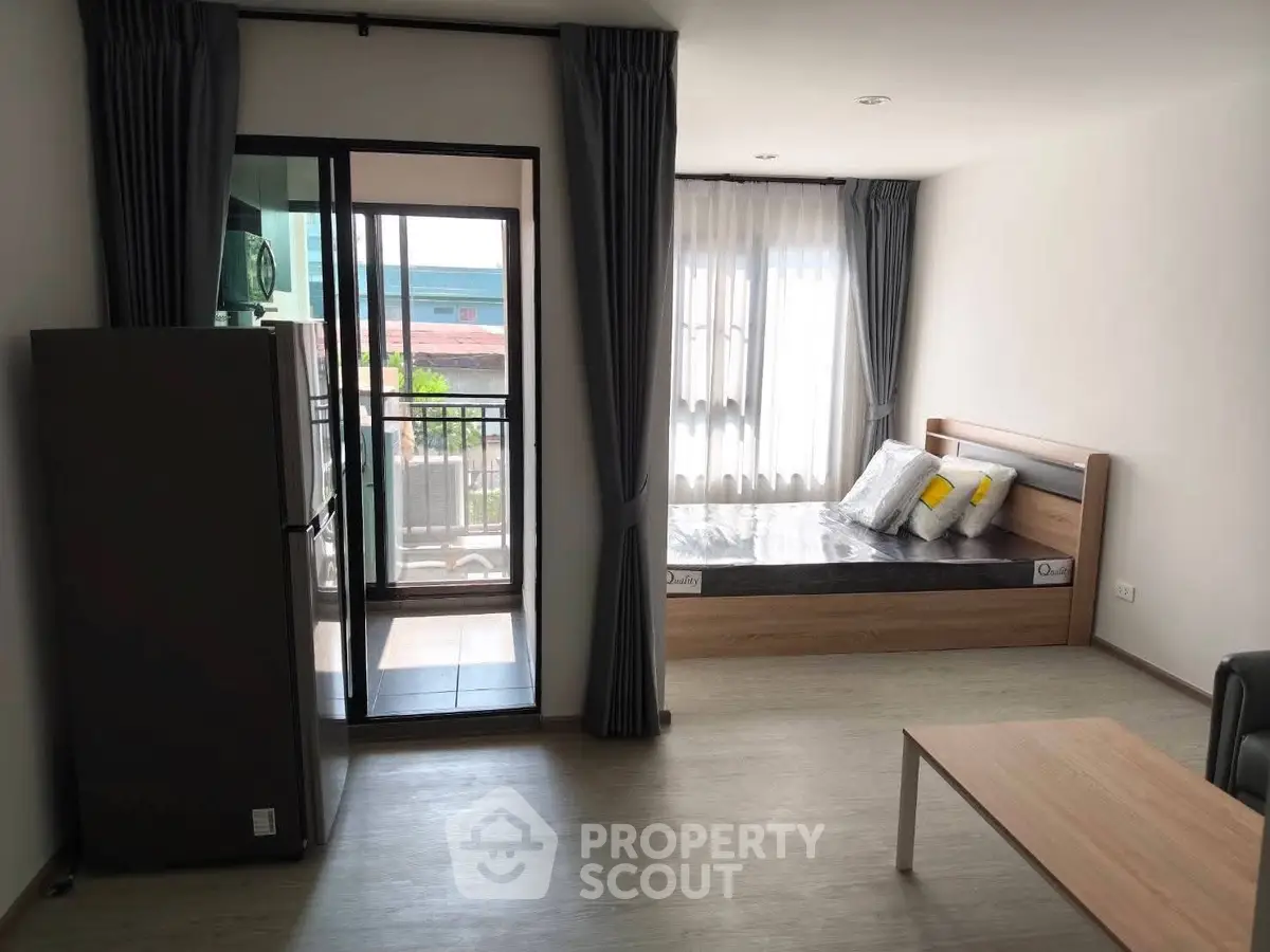 Modern studio apartment with balcony and natural light