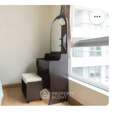 Elegant bedroom corner with vanity and large window view