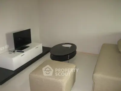 Modern living room with sleek furniture and minimalist design, perfect for urban living.