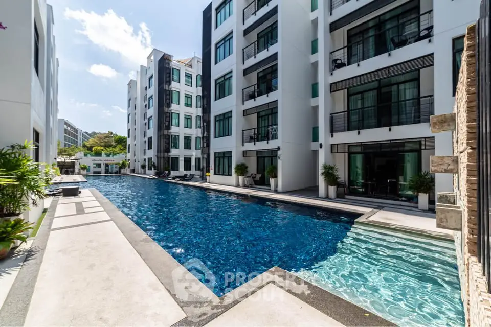 Luxurious apartment complex with stunning pool and modern architecture