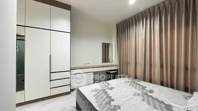 Modern bedroom with sleek wardrobe and stylish curtains