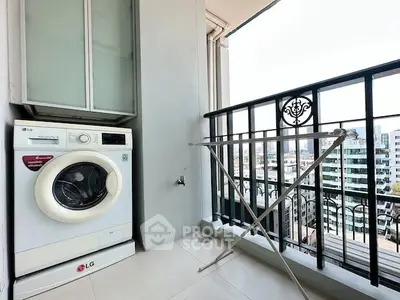 Modern balcony with washing machine and city view, perfect for urban living.