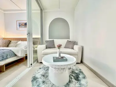 Modern cozy living room with stylish decor and comfortable seating in a bright apartment.