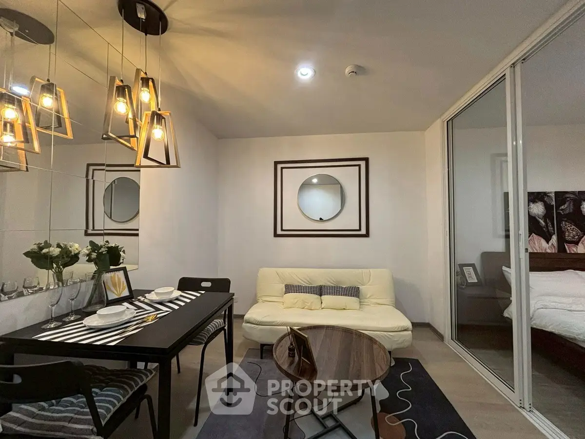 Modern living room with stylish lighting and cozy dining area