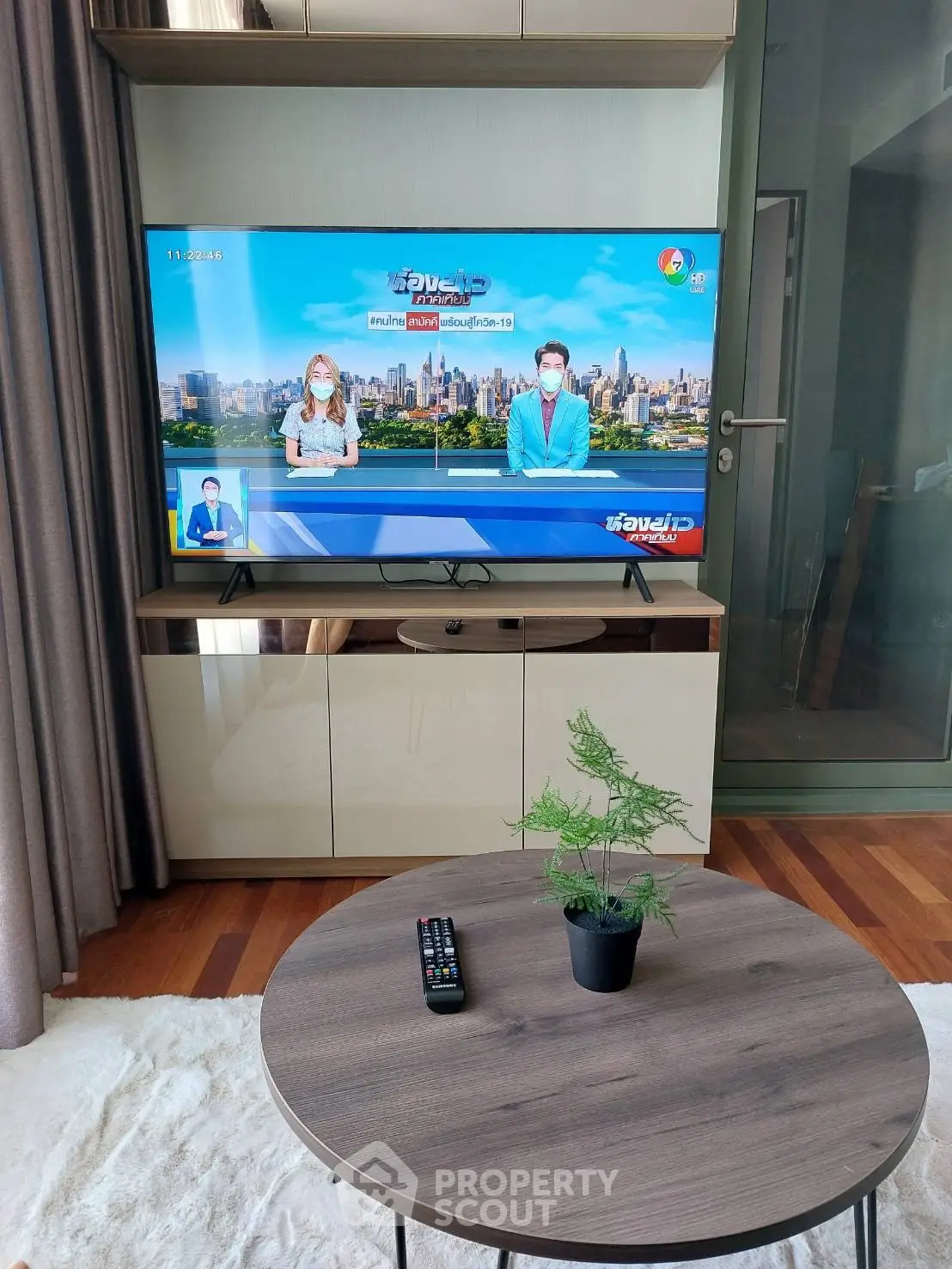 Modern living room with sleek TV setup and stylish coffee table