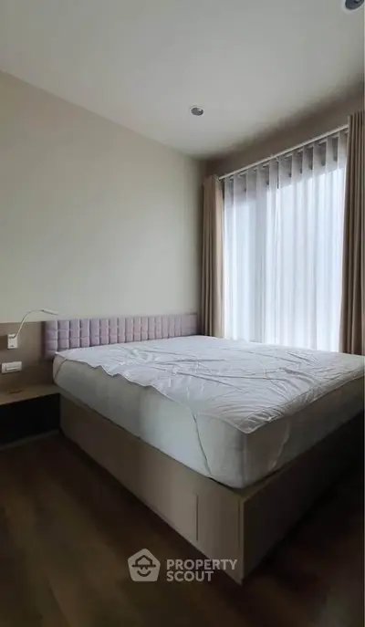 Cozy bedroom with natural light and modern design