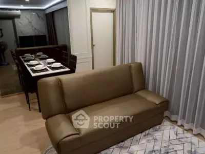Modern living room with elegant dining area and stylish sofa