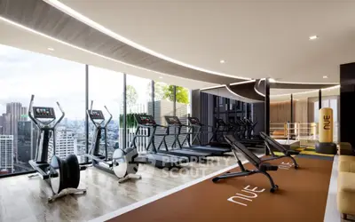 Luxury gym with panoramic city views and modern fitness equipment in high-rise building.