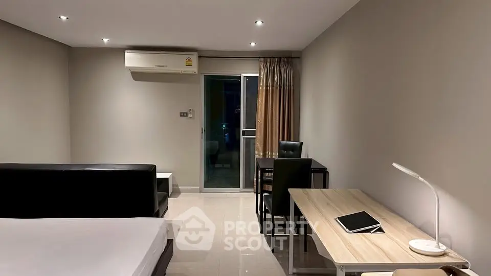 Modern studio apartment with sleek furniture and ambient lighting