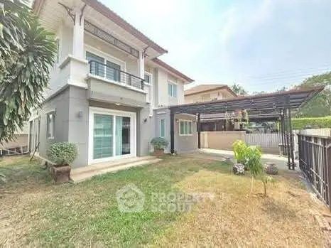 Charming two-story house with spacious garden and modern exterior design.
