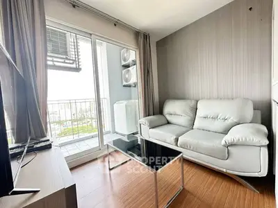 Modern living room with balcony view and sleek furniture in urban apartment