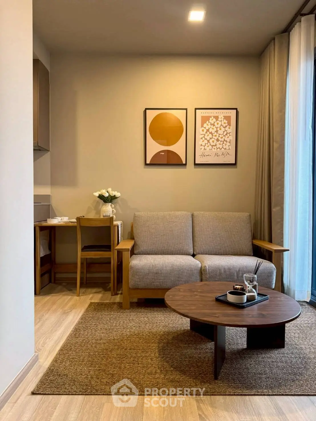 Cozy living room with modern decor and natural light, featuring a stylish sofa and coffee table.