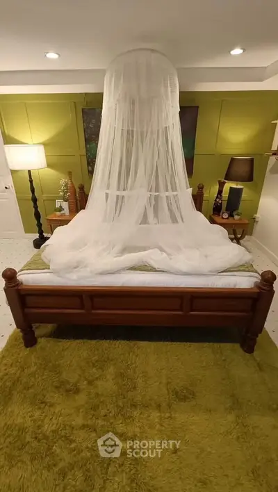 Cozy bedroom with elegant canopy bed and stylish decor