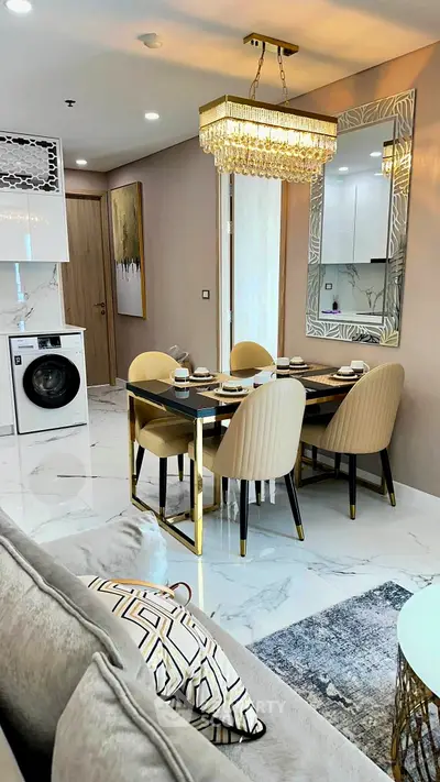 Luxurious modern living room with elegant dining area and built-in washing machine, featuring chic decor and lighting.