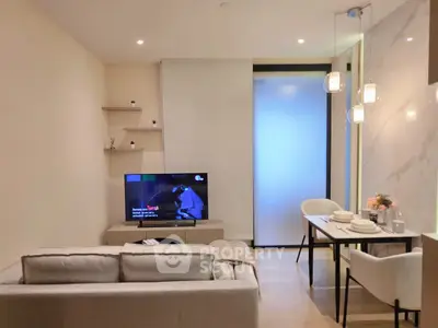 Modern living room with cozy sofa, TV, and elegant dining area, perfect for urban living.
