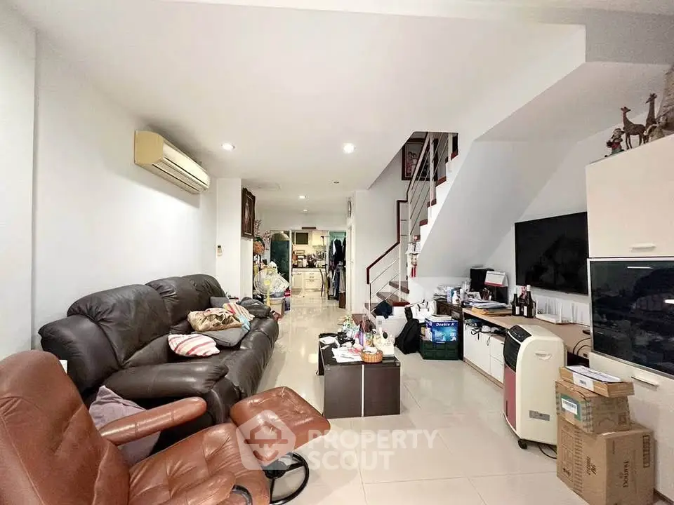 Spacious living room with modern furniture and open layout
