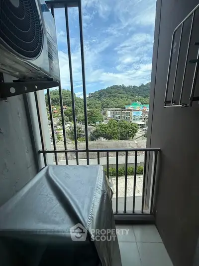 Charming balcony with scenic mountain view, perfect for relaxation and enjoying nature's beauty.