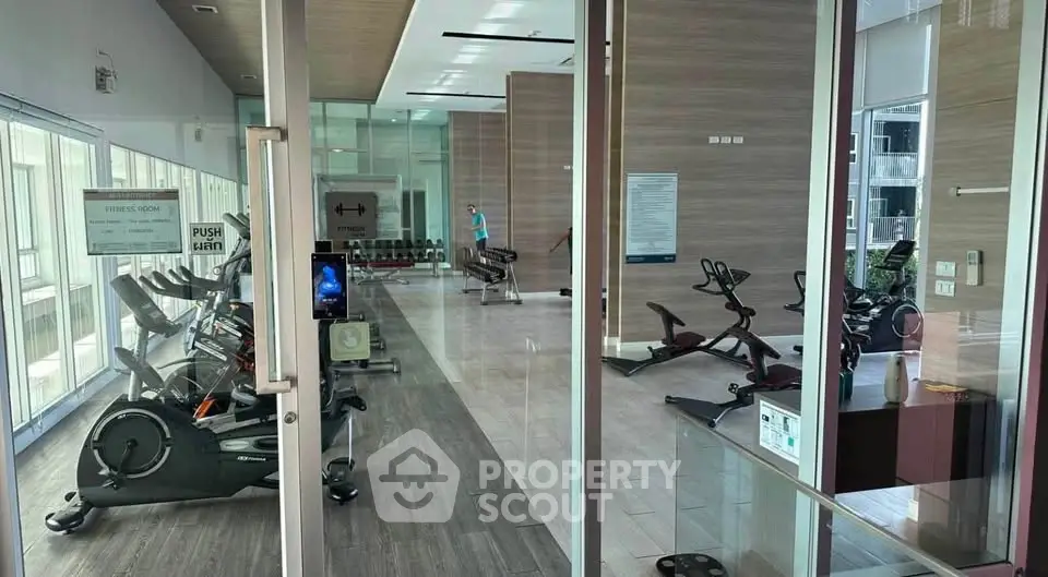 Modern gym with state-of-the-art equipment in luxury residential building