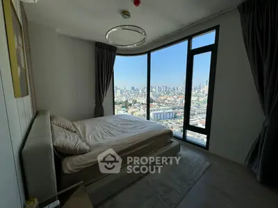 Luxurious bedroom with panoramic city view and modern decor