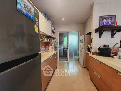 Spacious kitchen with modern appliances and ample storage in a cozy home setting.