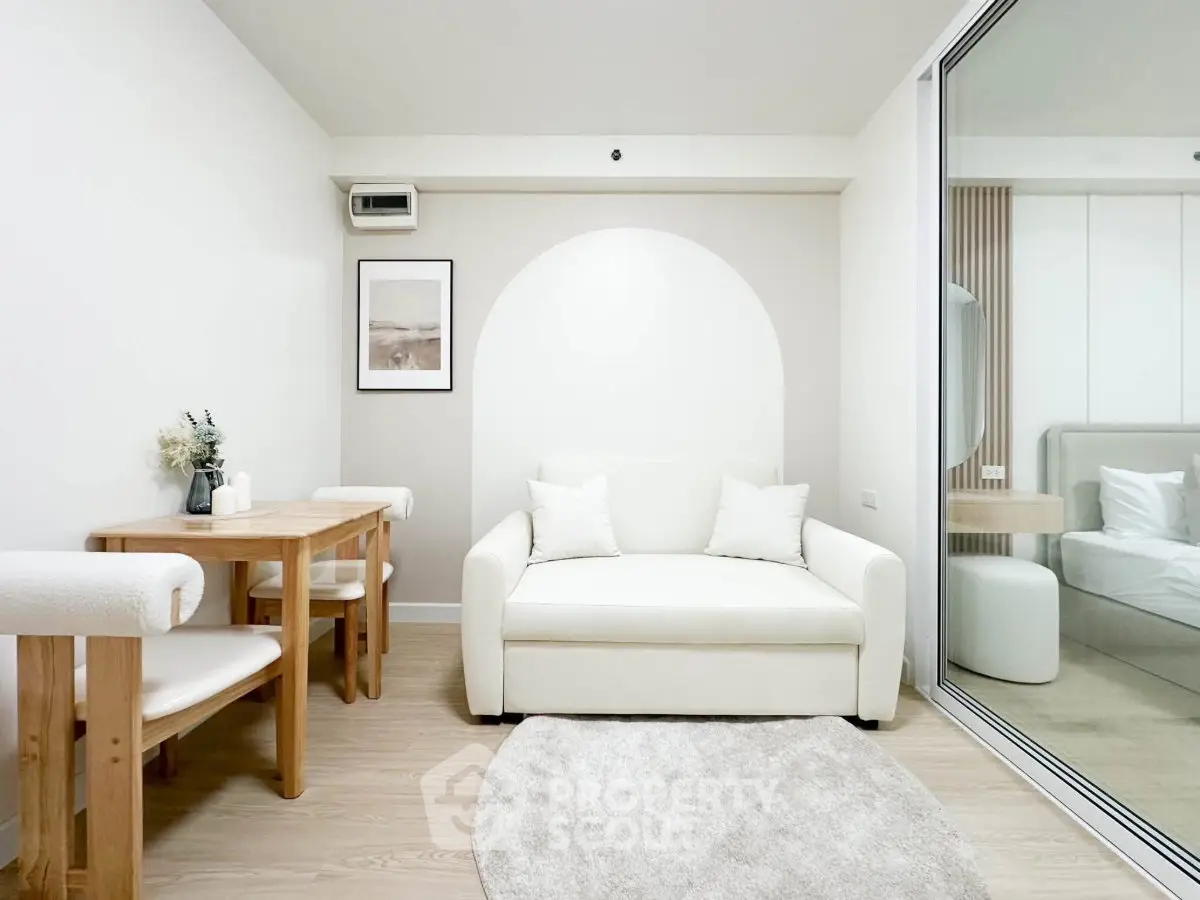 Modern minimalist living room with white sofa and wooden dining set