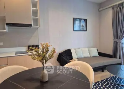 Modern living room with stylish decor and cozy seating area, perfect for relaxation and entertaining.