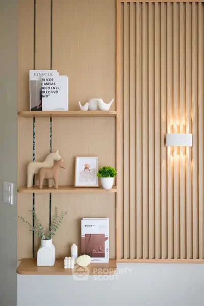 Stylish modern interior with wooden shelves and decorative items, perfect for contemporary living spaces.