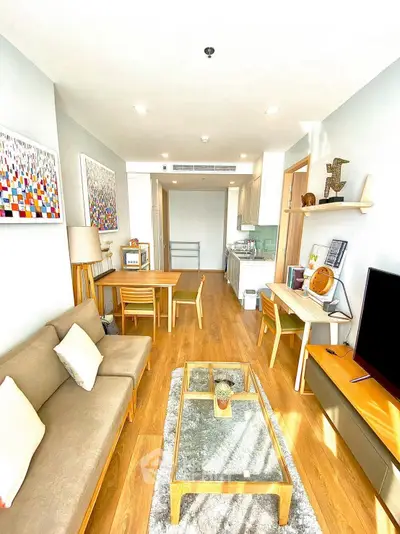 Bright modern living room with wooden flooring and stylish decor