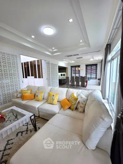 Spacious living room with elegant decor and large sectional sofa in modern home