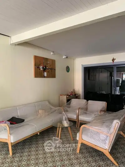 Spacious living room with modern furniture and artistic decor