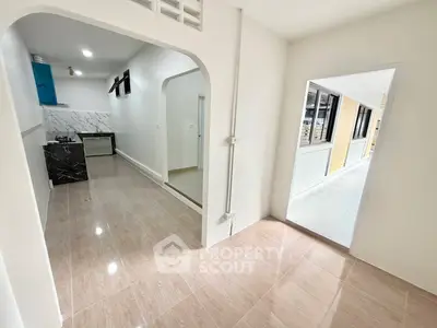 Spacious modern kitchen with sleek marble countertops and open layout, perfect for culinary enthusiasts.