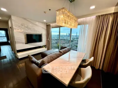Luxurious living room with stunning city view and elegant chandelier