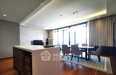 Luxurious open-plan living and dining area with modern design and natural light.