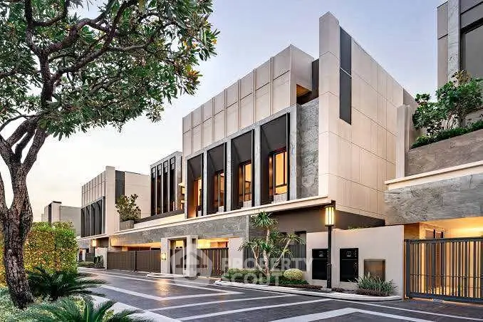 Modern luxury townhouse exterior with sleek design and lush landscaping