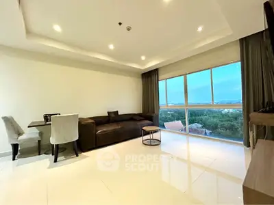 Spacious modern living room with large windows offering stunning views and elegant furniture.