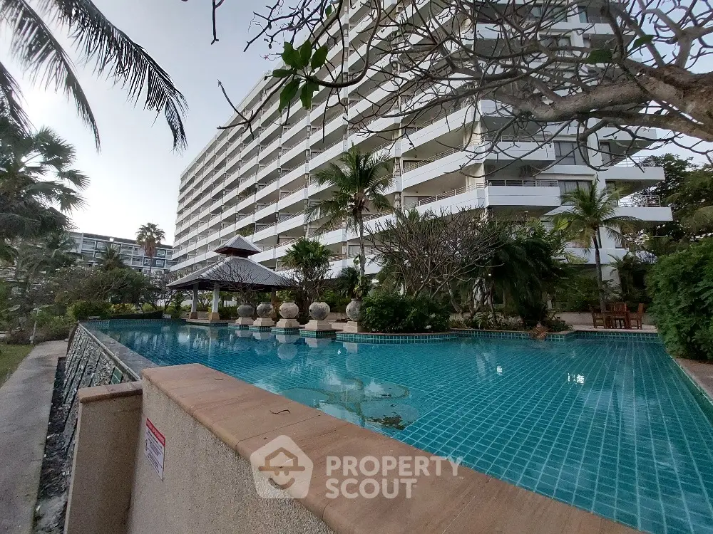 Luxurious condominium with stunning pool and lush garden view