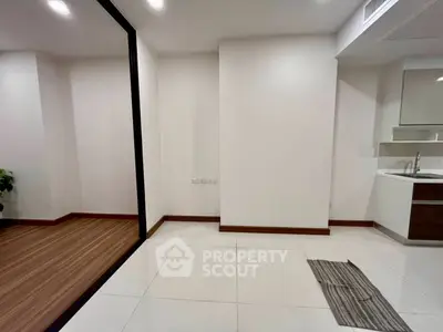 Modern minimalist interior with sleek flooring and stylish kitchenette