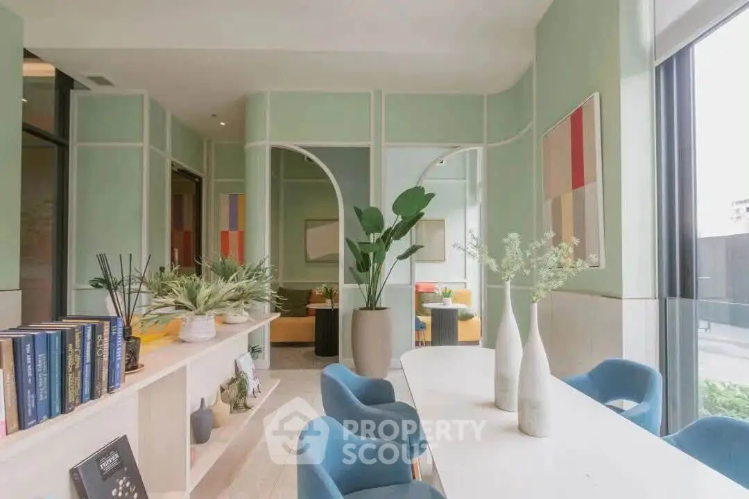 Stylish modern living room with elegant decor and large windows offering natural light.