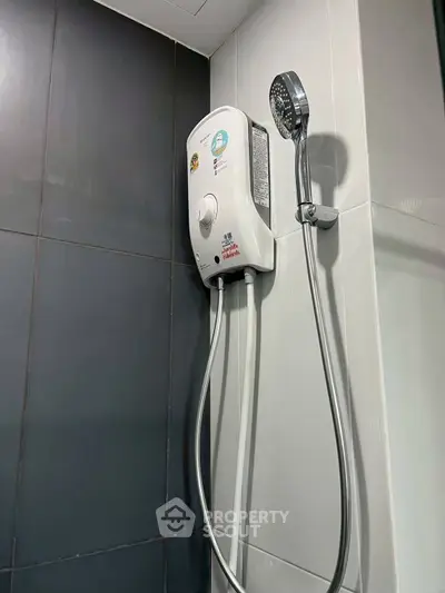 Modern bathroom with sleek shower unit and contemporary design.